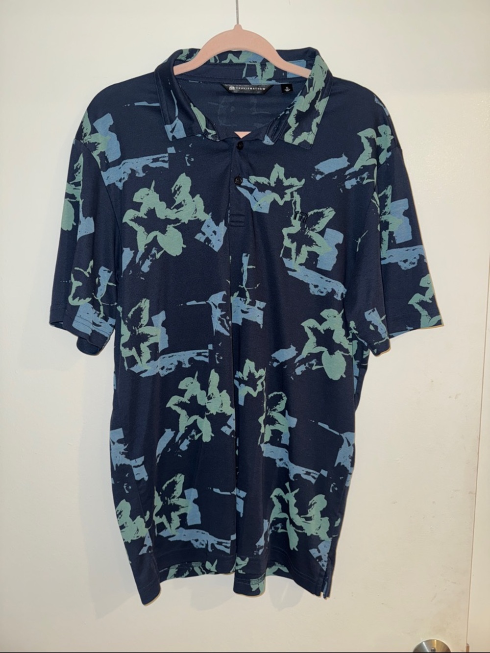 Travis Mathew Navy Polo with Blue and Green Floral Print Accent